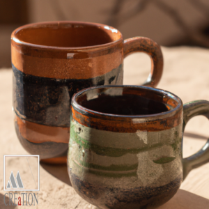 "Earthen Elegance: Handpainted Green and Orange Ceramic Sandblasted Mug"