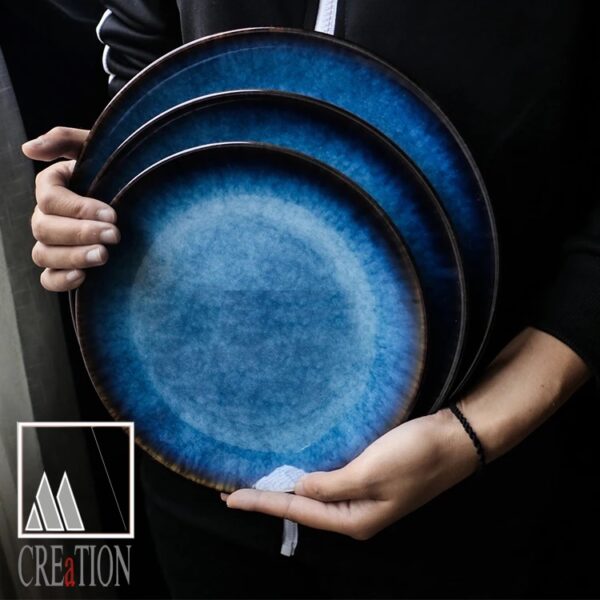 Bring sophistication to your dining table with the Midnight Medley Tunisian Varnished Ceramic Plate. Made with care in the M'Creations workshop in Nabeul, this luxurious high-quality plate is a true work of art. The deep, dark blue ceramic finish is hand-painted with attention to detail, showcasing the traditional Tunisian hand work.